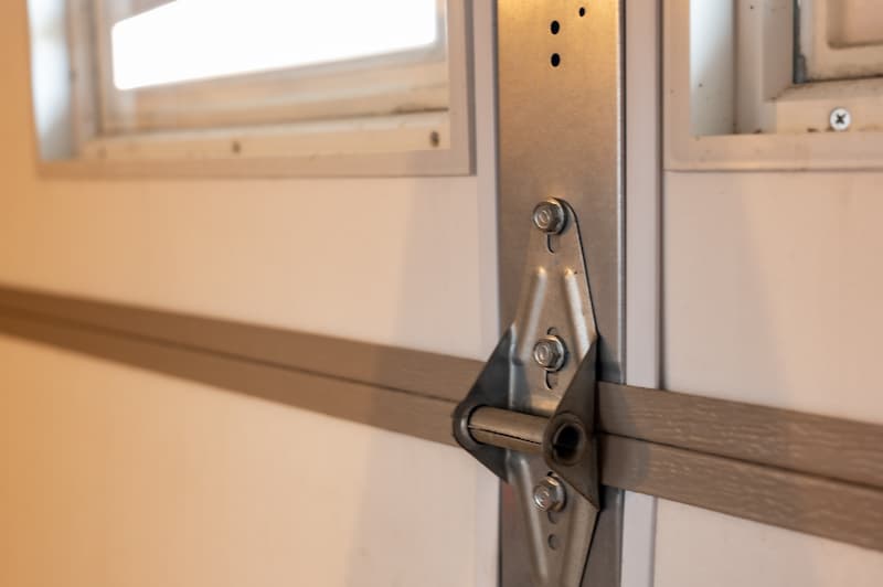 Close up of a garage door hinge