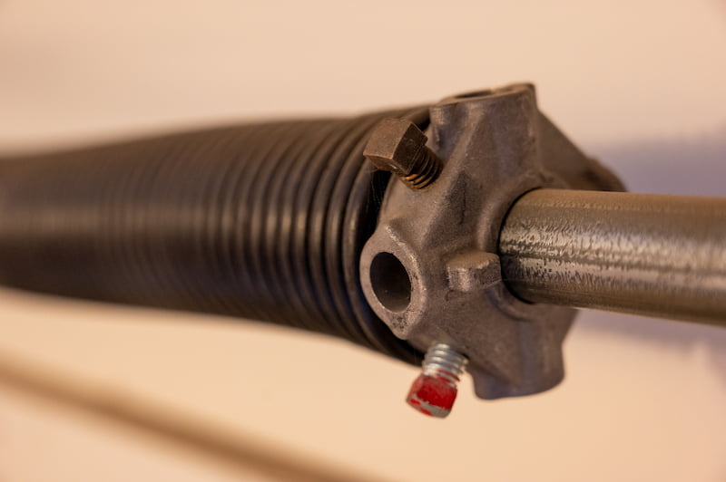 Garage door center bearing and spring