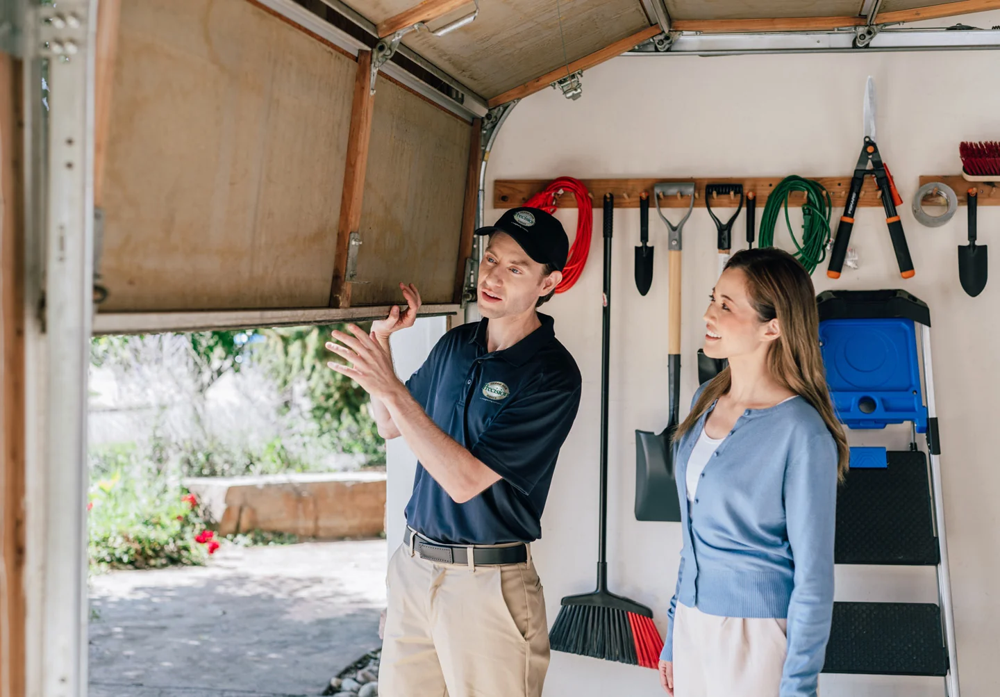 Precision Garage Door technician helping customer with garage door repairs